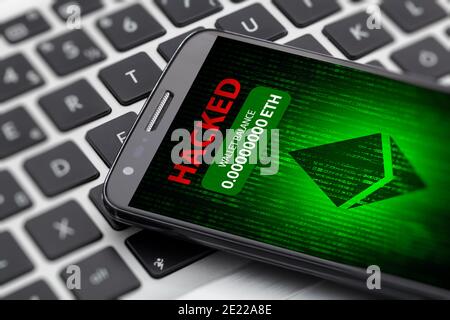 ethereum wallet hacked message on smart phone screen. cryptocurrency theft concept Stock Photo