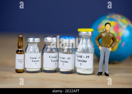 World and bottle with vaccine. Coronavirus, Covid-19, Medicine, science and healthcare concept Stock Photo