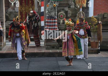 Balinese locals performing Barong, a mythical lion-like creature at a traditional ceremony in Bali. Stock Photo