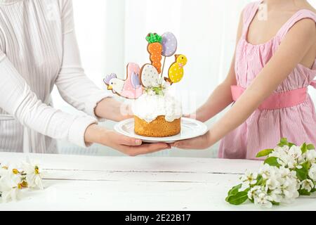 Easter composition with a beautifully decorated Easter cake. The concept of preparing for the family holiday Easter. Stock Photo