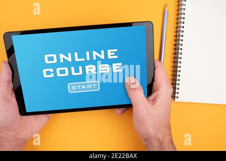 person participating in online course on tablet computer, e-learning and online education concept Stock Photo