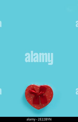 Heart shaped box on blue background Stock Photo