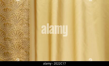 Silk texture with floral pattern. Chinese brocade, beautiful expensive fabric background. Embroidery with gold ornament on fabric Stock Photo