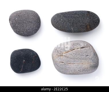Set of various grey pebble stones isolated on white background. View from above Stock Photo