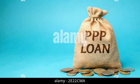Money bag with the word PPP loan - Paycheck Protection Program. Loan designed to provide a direct incentive for small businesses to keep their workers Stock Photo