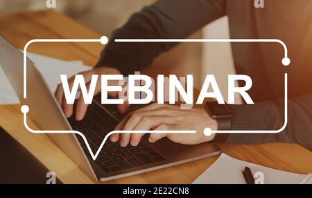 Webinar inscription over unrecognizable businessman using laptop Stock Photo