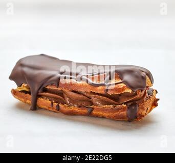 freshly baked eclair on white background Stock Photo