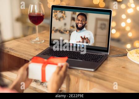 Black couple having online date, celebrating anniversary Stock Photo