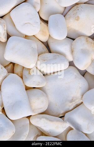 Background of roundish stone. Texture in the form of white rocks. Background of big white stones. Stock Photo