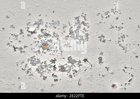 Background of old wall with traces of rust. Peeling paint with dirty marks on the concrete. The texture of dried plaster that falls off the wall. Stock Photo