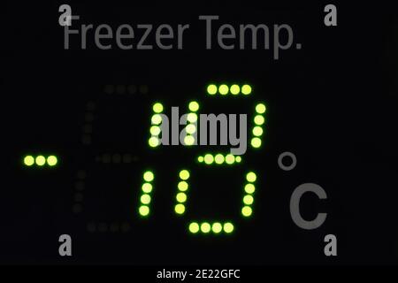 Close up of a freeze indicator showing -18 degrees in green led letters Stock Photo