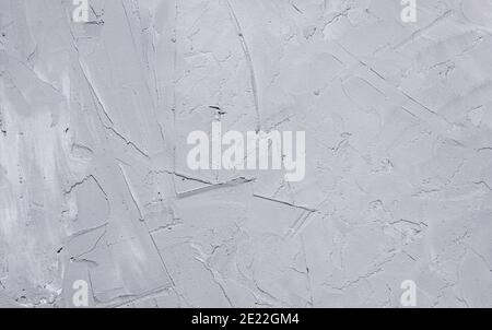 Concrete gray wall plastered with large rough strokes. The texture of the plaster close-up. Stock Photo