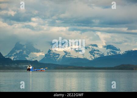 Fishing boat  from Puerto Mont, the Last Hope Sound / Golfo Almirante Montt at Puerto Natales, Patagonia, Chile, with the Torres Del Paine and Andes. Stock Photo