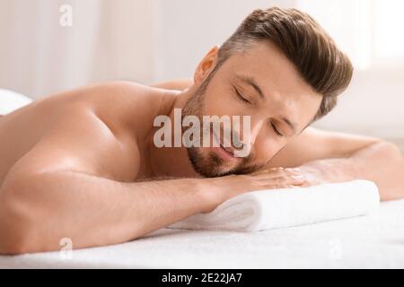 Relaxed middle aged man attending spa salon Stock Photo