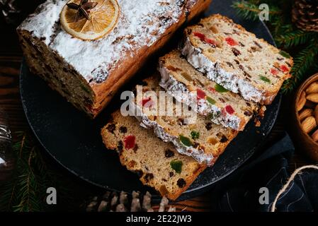Christmas stollen on wooden background. Traditional Christmas festive pastry dessert. Stollen for Christmas Stock Photo