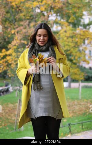 Close-up pregnant woman in the park. Stock Photo