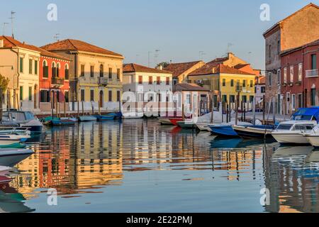 Sunset Canal - Sunset view of calm and colorful Canale San Donato on Murano Islands. Venice, Veneto, Italy. Stock Photo