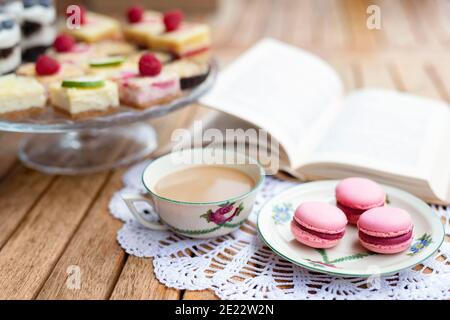 Cup of coffee and desserts on table, close-up. Stock Photo