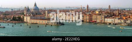 Venice Skyline - Aerial panoramic evening view of Venice skyline at the intersection of the Grand Canal and the Giudecca Canal. Venice, Veneto, Italy. Stock Photo