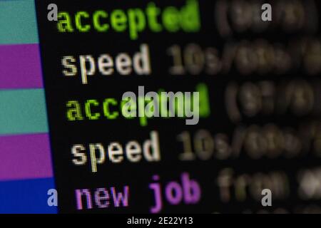 Colorful terminal window on computer screen with running software jobs for mining cryptocurrency and results Stock Photo