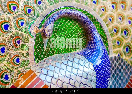 Peacock, glass inlay work, in Udaipur City Palace on December 12, 2015 in Udaipur, India. A detail of Mor Chowk (Peacock Yard). Stock Photo