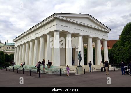People at the exterior of the neoclassical Theseus Temple at the center of the public park Volksgarten (Garden of the people) in Vienna, Austria. Stock Photo