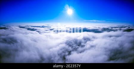 Sunny sky abstract background, beautiful cloudscape, on the heaven, view over white fluffy clouds, freedom concept Stock Photo