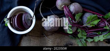 bunch of beetroots on old wood background. Top view. Freshly picked vegetables beetroot Stock Photo