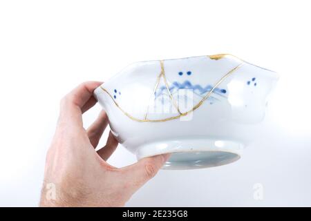 Blue and white antique Kintsugi, Japanese pottery restored with real gold  Stock Photo - Alamy