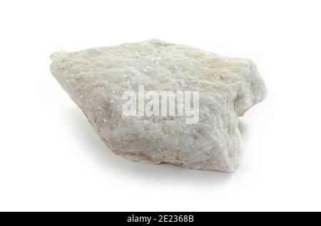 A piece of white marble from Thasos. Macro shooting of metamorphic rock specimens - white marble stone isolated on white background. Stock Photo