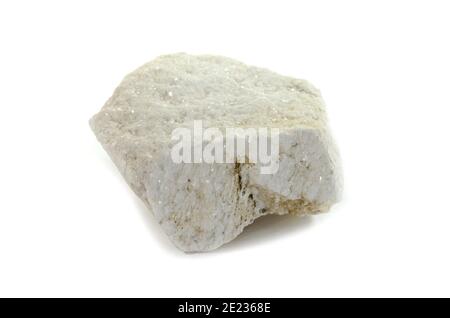 A piece of white marble from Thasos. Macro shooting of metamorphic rock specimens - white marble stone isolated on white background. Stock Photo