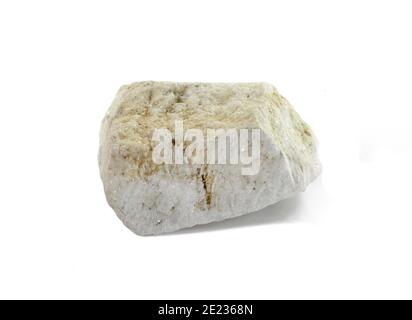 A piece of white marble from Thasos. Macro shooting of metamorphic rock specimens - white marble stone isolated on white background. Stock Photo