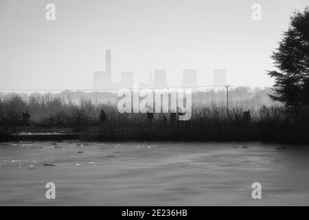 Fiddlers Ferry power station in mist looking from Clockface Country Park Stock Photo