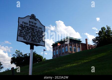 Sign marking site of Fort Cumberland store houses, Masonic Temple building in background, Cumberland, Maryland MD, USA Stock Photo