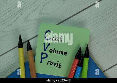 Cost Volume Provit write on sticky notes isolated on Wooden Table. Stock Photo