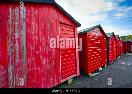 Image of fishermans huts painted red on the pier at Rozel Harbour, St Martin, Jersey, Channel Islands Stock Photo