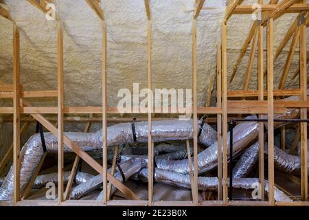 New home construction on the roof thermal insulation a new house under the roof of air Stock Photo