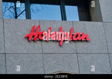 Lugano, Ticino, Switzerland - 8th January 2020 : Hotelplan sign hanging on a building in Lugano, Switzerland. Hotelplan is one of the biggest travel a Stock Photo