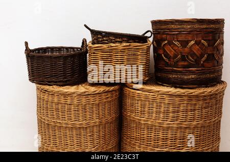 Close up handmade entwine straw wicker baskets with handle and cap for home storage, natural interior details Stock Photo