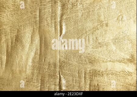 Golden shiny background. Gold Leaf Foil Texture Stock Photo