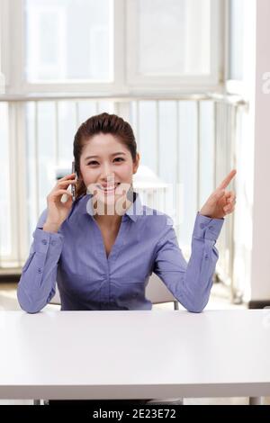 A young Business woman using a smartphone high quality photo Stock Photo