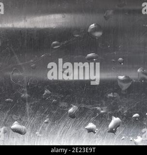 droplets of water on grey steel texture useful as a background Stock Photo