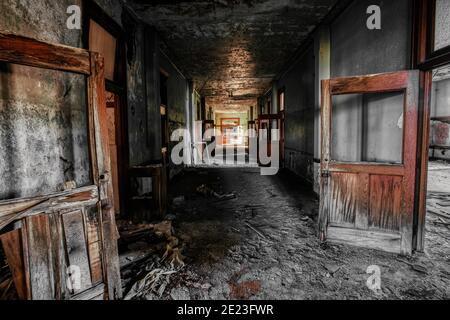 The symbolic educational decline in America, an abandoned church school hallway in disarray in Detroit, Michigan. Stock Photo