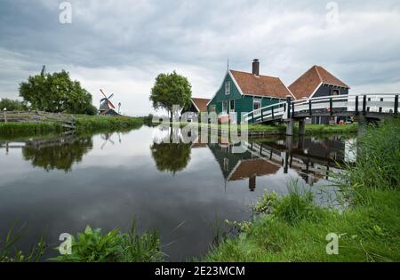 Classic view of the green houses and windmills in Zaanse Schans Stock Photo