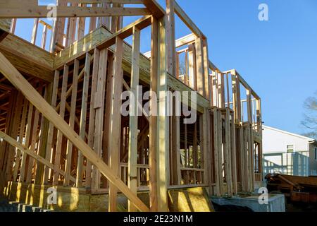 Wood building frame structure on a new development framing of new house under construction Stock Photo