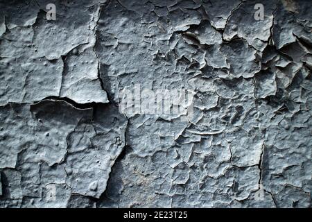 Textured wall with peeling blue paint. Old building. Beautiful abstract background. Stock Photo