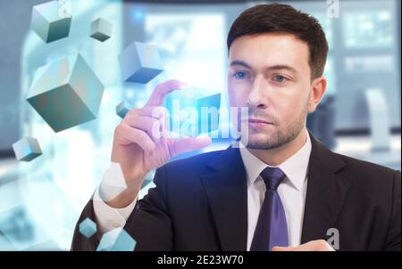 Business, Technology, Internet and network concept. Young businessman working on a virtual screen of the future and sees the inscription: Video market Stock Photo