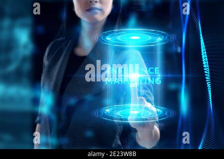 Business, Technology, Internet and network concept. Young businessman working on a virtual screen of the future and sees the inscription: Influence ma Stock Photo