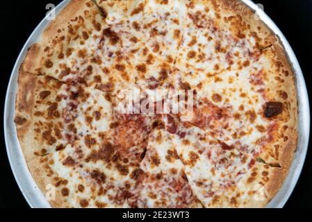 Overhead view of cheese pizza for that plain flavor that many picky eaters prefer. Stock Photo
