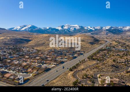 RENO, NEVADA, UNITED STATES - Dec 29, 2020: An aerial view of Mt Rose Highway (Nevada State Route 431) as it climbs west toward the Sierra Nevada moun Stock Photo